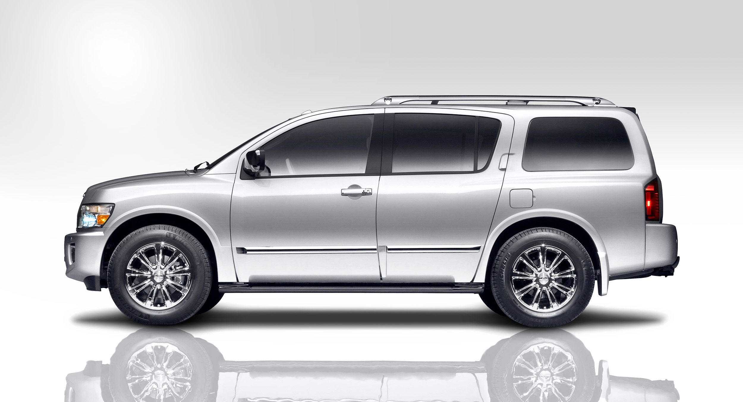 John Early High-End Digital Retouching - Infiniti QX56 on White Reflective Background