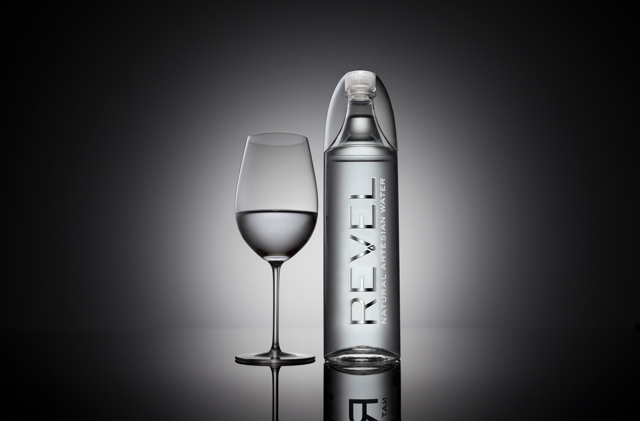 John Early High-End Digital Retouching - Revel Water Bottle and Water Glass Shot in Studio
