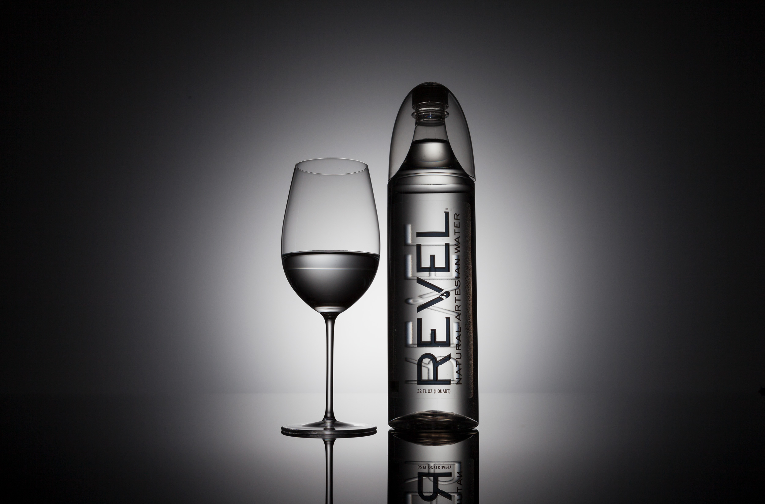 John Early High-End Digital Retouching - Revel Water Bottle And Glass on Gradated Background